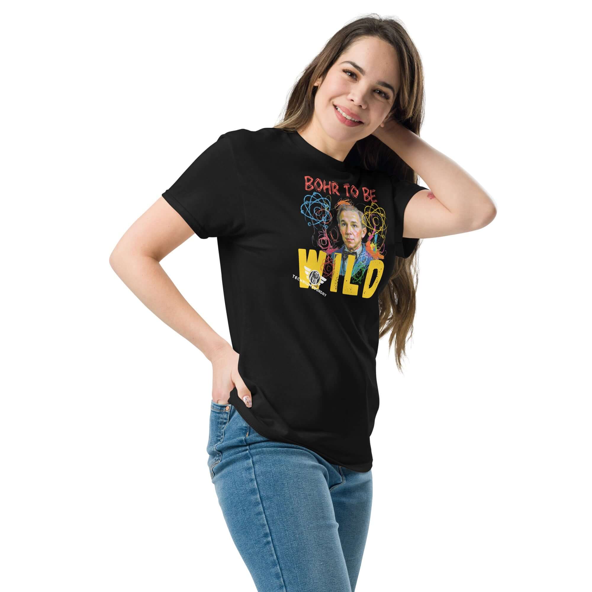 Woman wearing 'Bohr to Be Wild' science rock & roll fusion art t-shirt, featuring Niels Bohr portrait and atomic energy design.