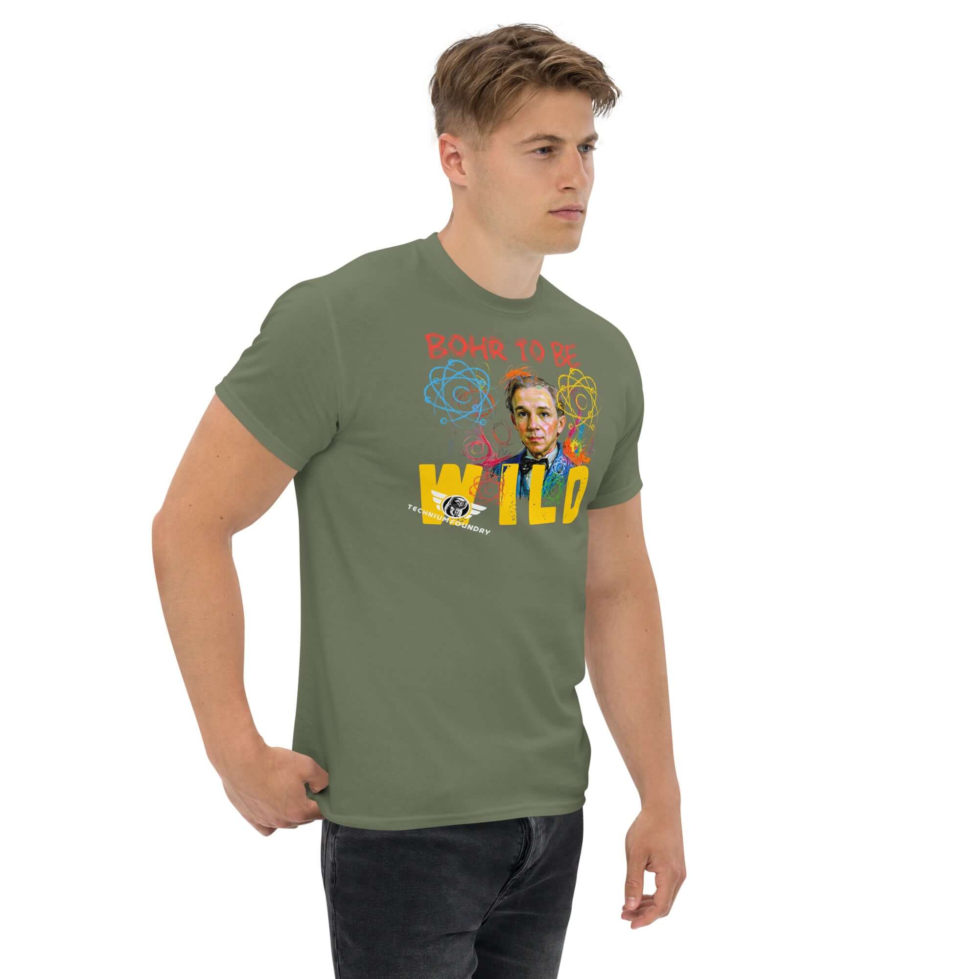 Man wearing 'Bohr to Be Wild' t-shirt featuring Niels Bohr portrait with rock and roll fusion design in green color.