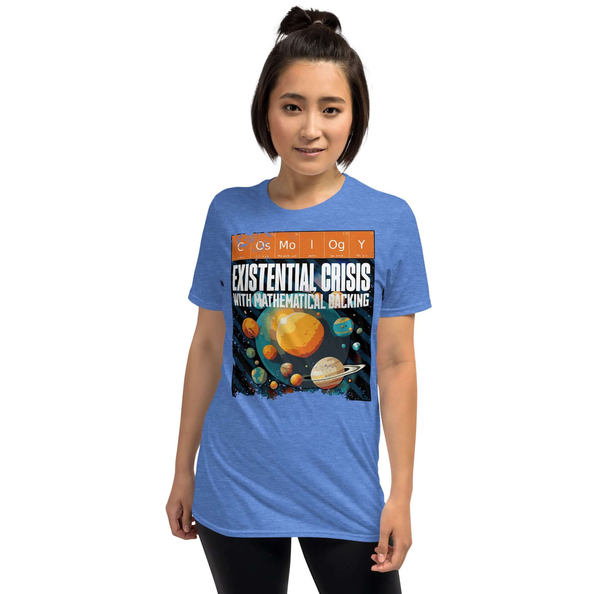 Woman wearing blue 'Cosmology: Existential Crisis With Mathematical Backing' t-shirt featuring a cosmic design and periodic table elements.