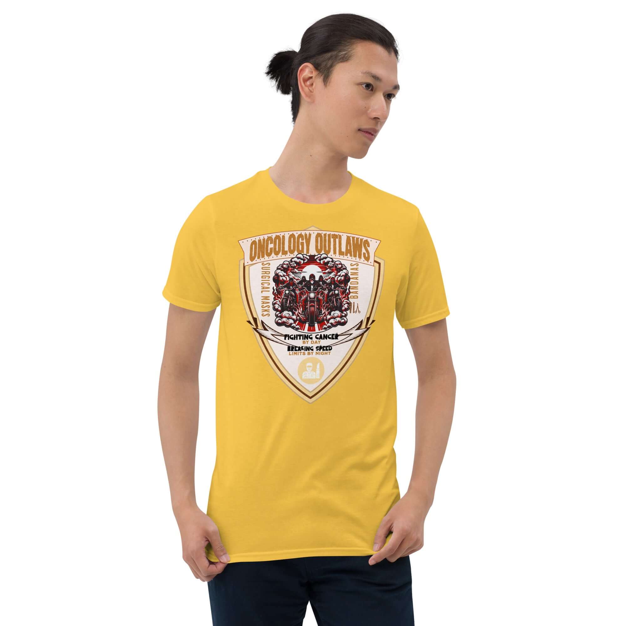 Person wearing yellow Oncology Outlaws Motorcycle Club T-shirt, featuring a shield-shaped emblem celebrating cancer fighters.