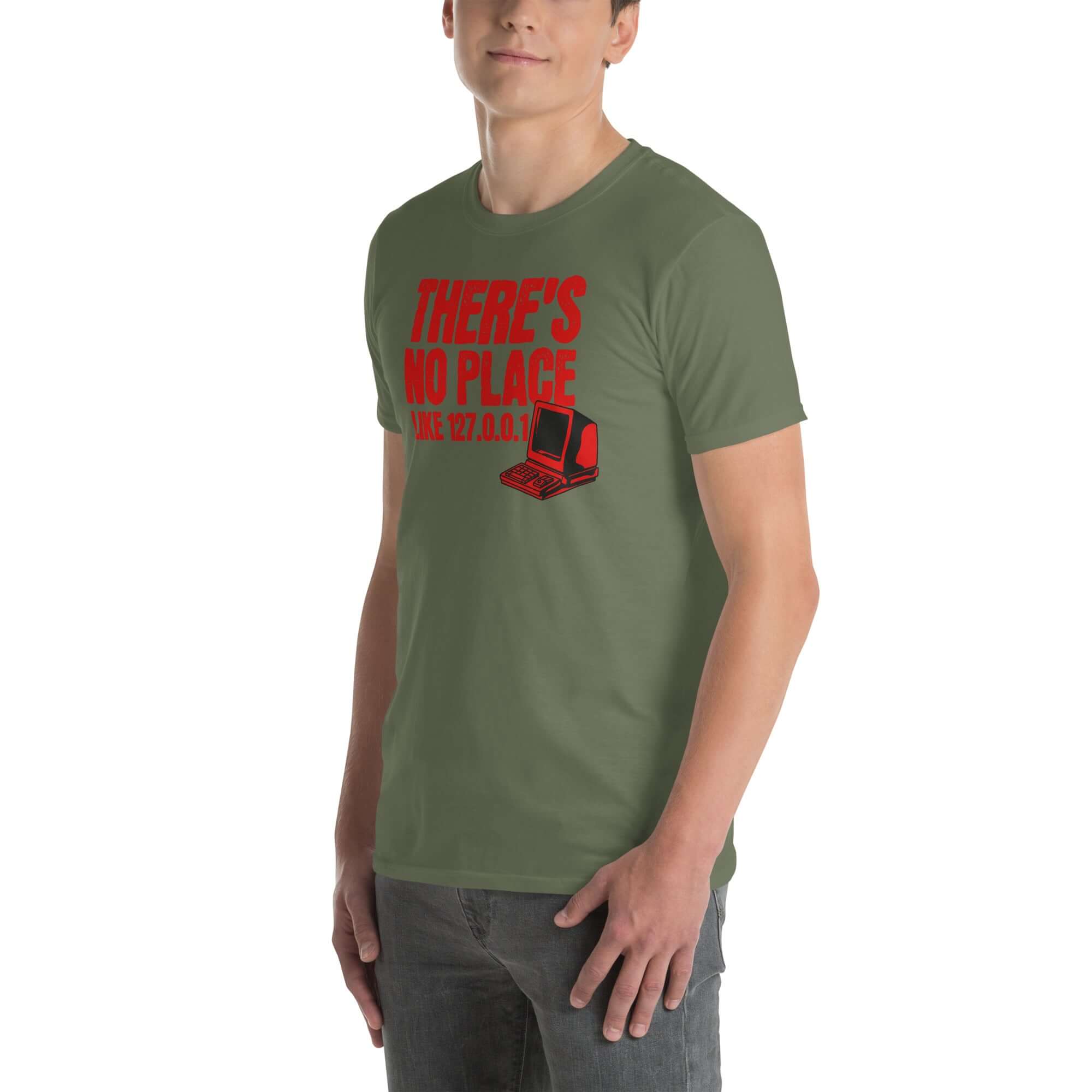 Model wearing 'There's No Place Like 127.0.0.1' t-shirt, featuring red text and a computer graphic, ideal for tech enthusiasts.