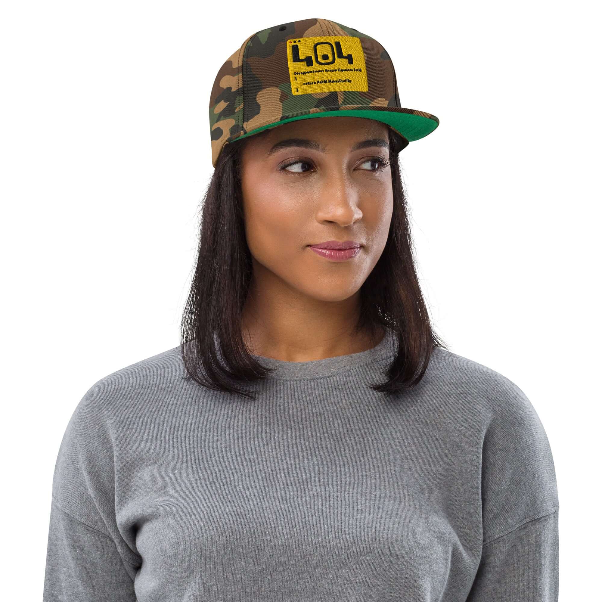 404 Disappointment Hat with error code text on camo snapback, worn by a model, perfect for developer humor and technical difficulties.
