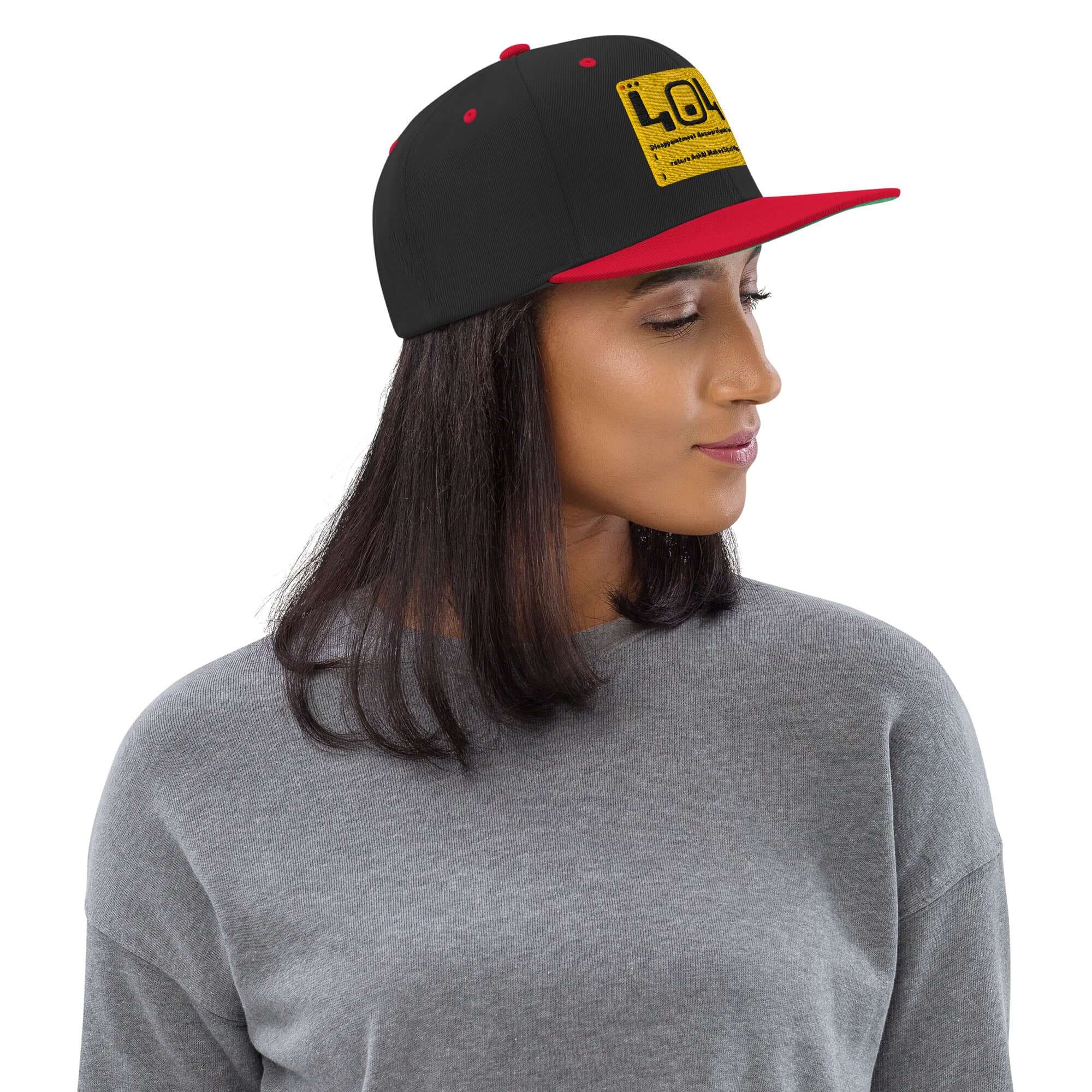 Woman wearing a black and red snapback hat with a humorous 404 error message, perfect for developers and tech enthusiasts.