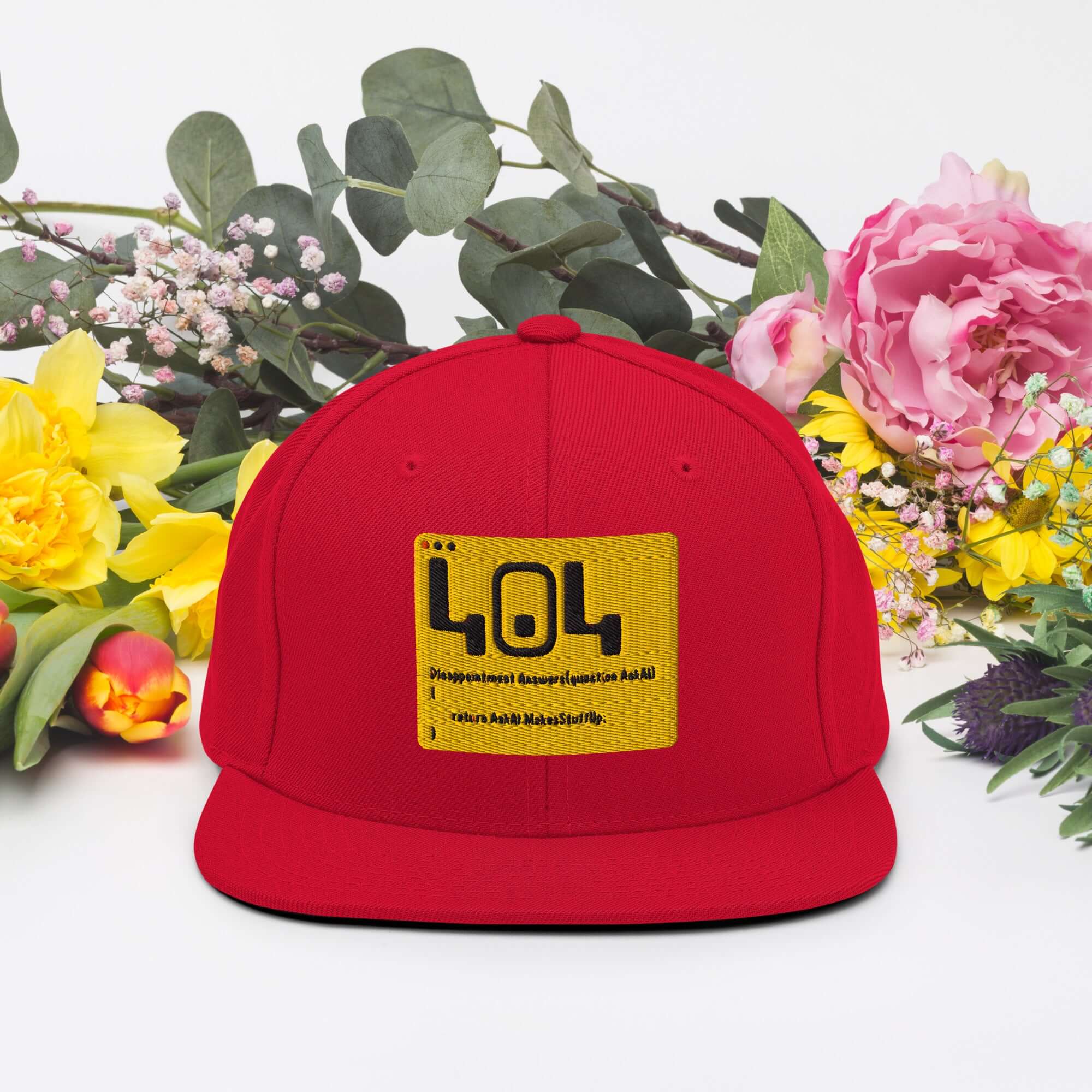 Red 404 Disappointment Hat with Error Code Patch, surrounded by colorful flowers, perfect for developer humor and tech enthusiasts
