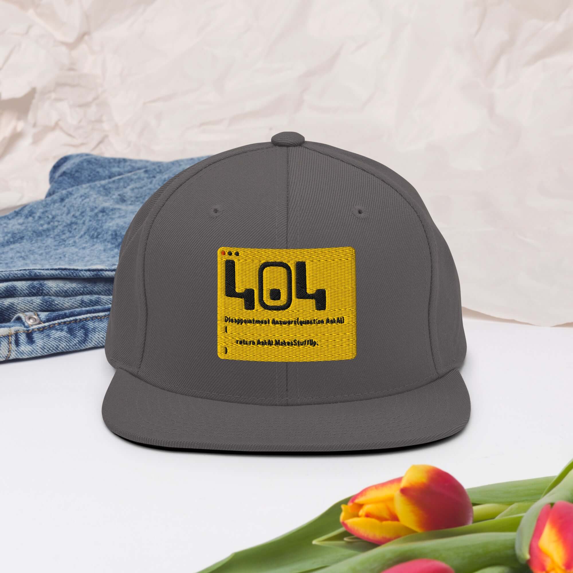 Dark 404 Disappointment Hat with yellow error code patch, perfect for developers' humor in a stylish snapback design.