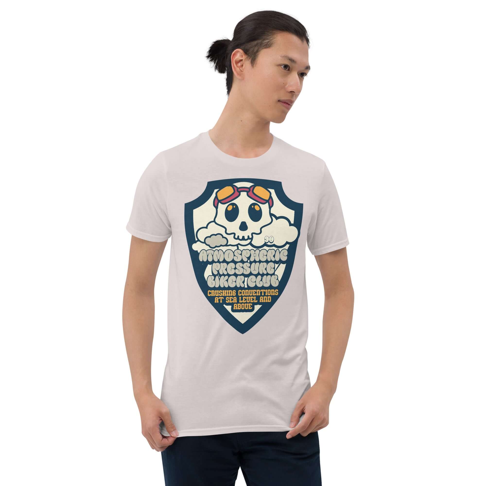 Man wearing Atmospheric Pressure Biker Club t-shirt featuring a skull with aviator goggles and clouds, meteorological biker apparel.
