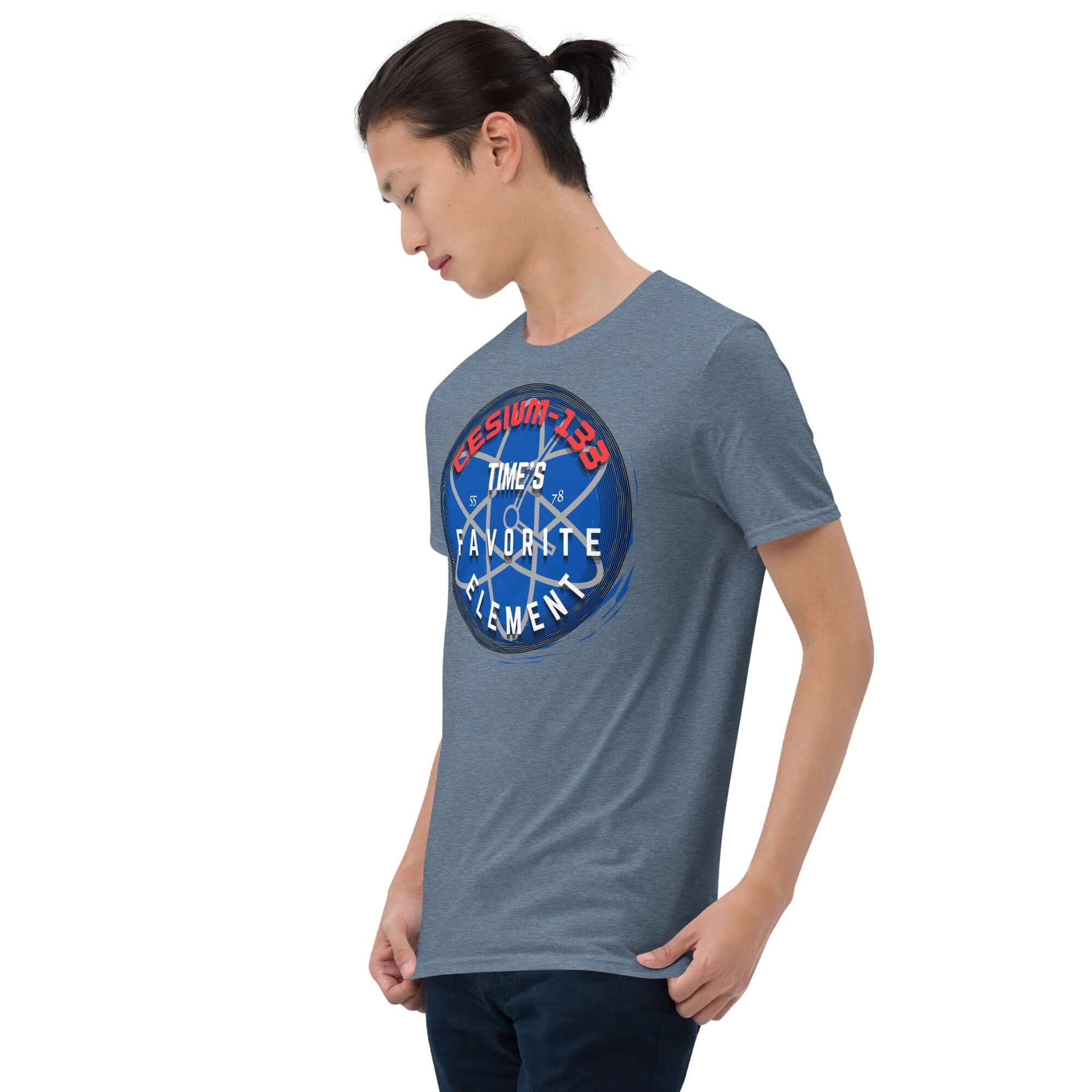 Man wearing Cesium-133 Atomic Clock T-Shirt with blue design. Time's favorite element shirt for precise timekeeping enthusiasts.