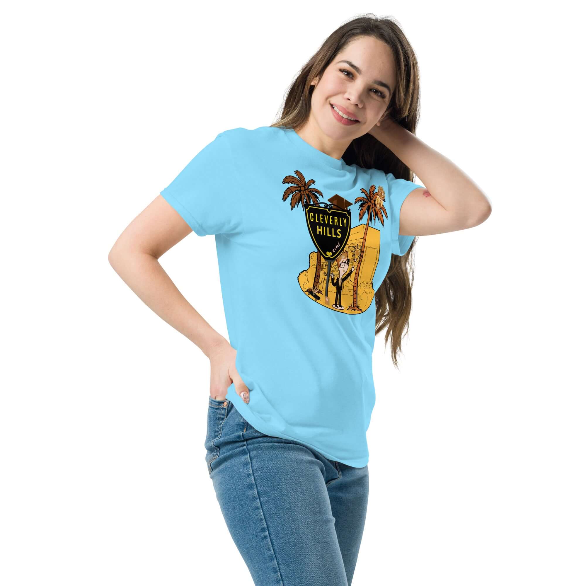 Woman wearing a Cleverly Hills E=mc² T-Shirt, Beverly Hills science parody design with palm trees and shield-shaped sign.