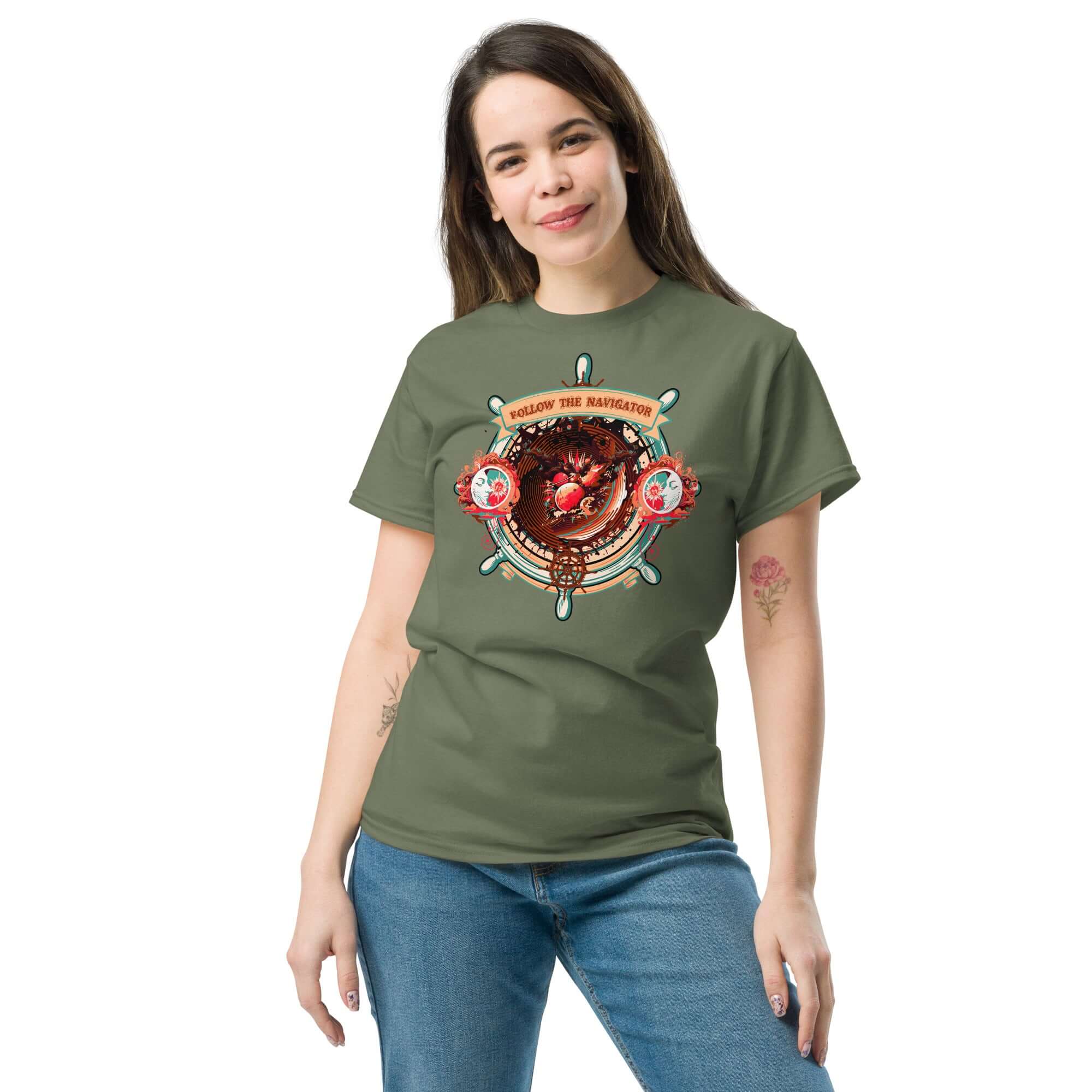 Person wearing a green t-shirt featuring a celestial-themed ship's wheel design, labeled "Follow The Navigator."