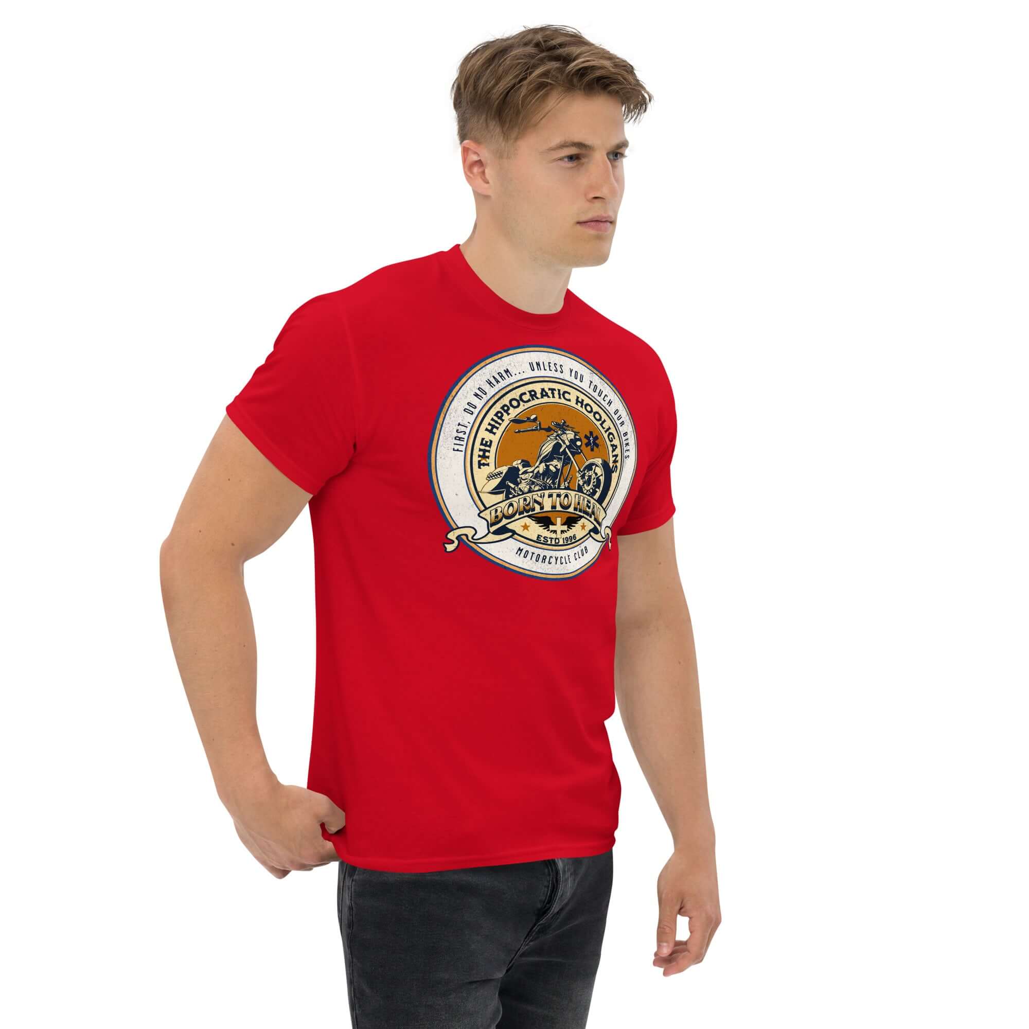 Man wearing a red 'Hippocratic Hooligans' Motorcycle Club T-Shirt, featuring a vintage biker patch design.