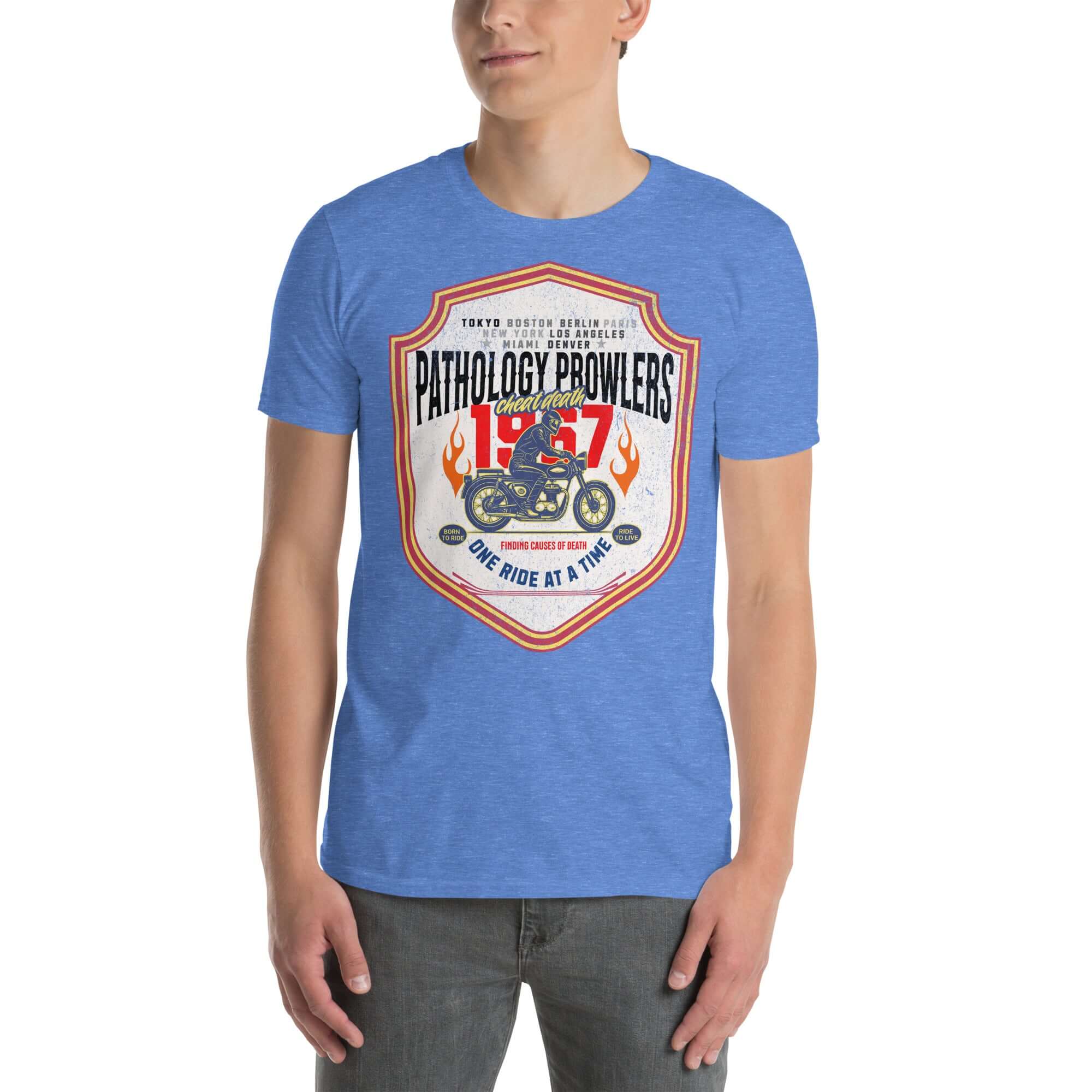Man wearing Pathology Prowlers MC T-shirt, blue forensic motorcycle club tee with vintage shield emblem design.