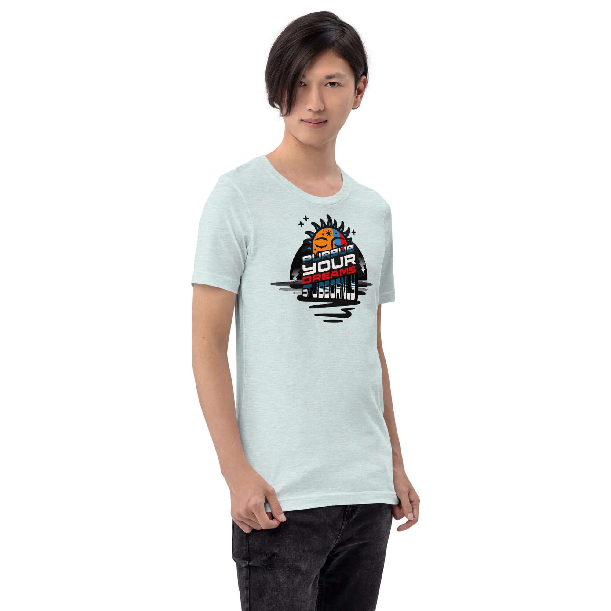 Male model wearing 'Pursue Your Dreams Stubbornly' T-shirt by Cosmic Motivation Apparel with a cosmic design. Motivational clothing