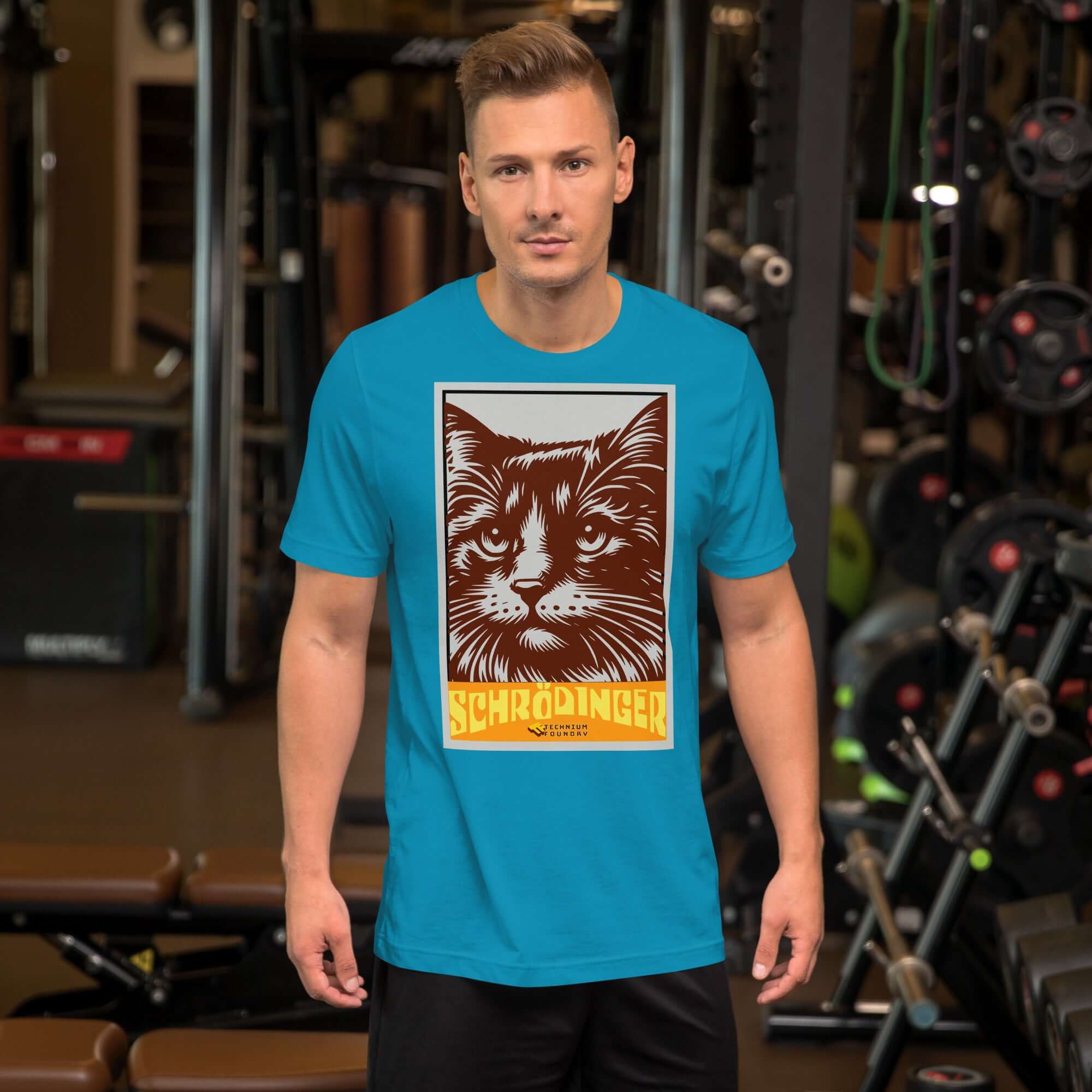 Man wearing Schrödinger's Cat T-Shirt with retro cat design, gym background.