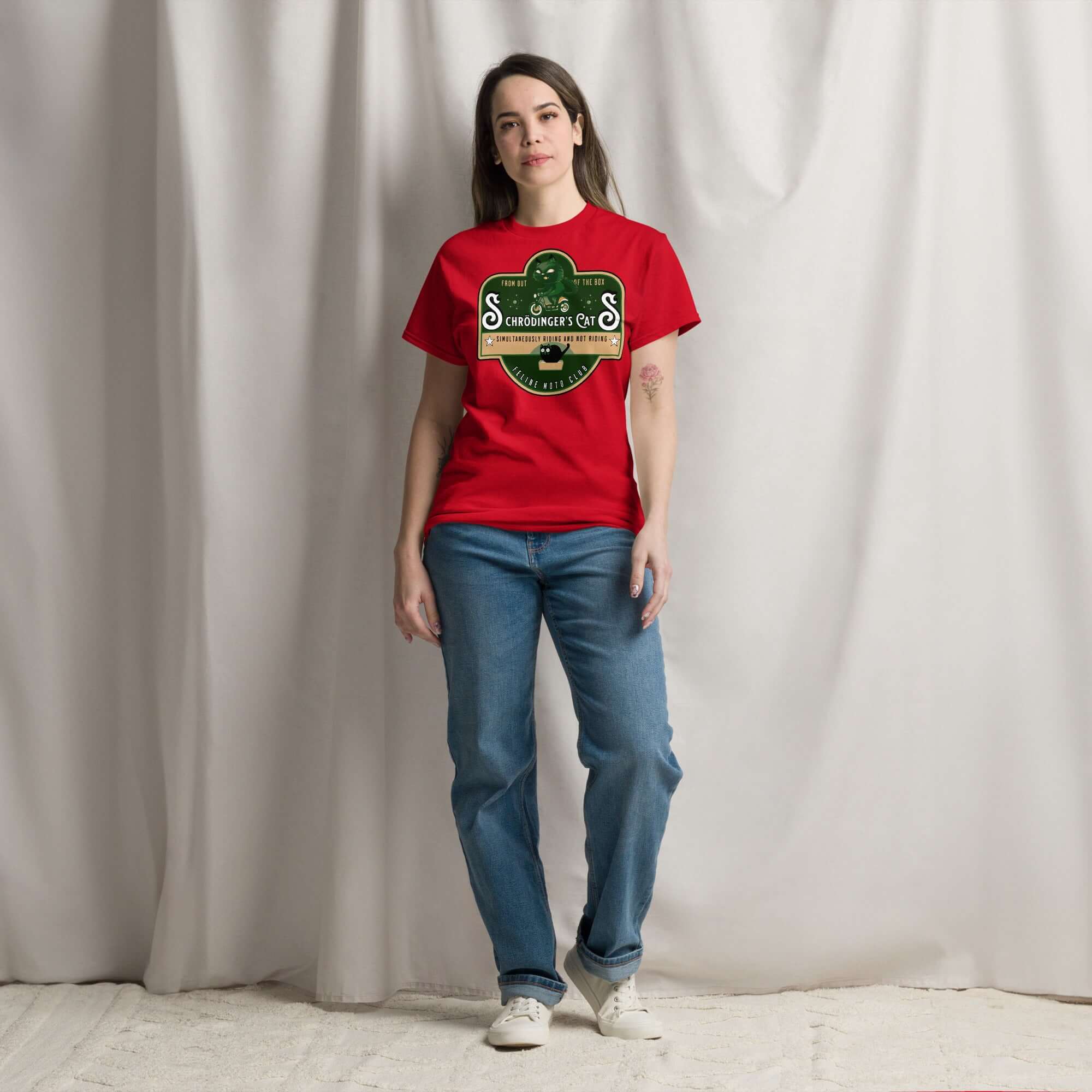 Woman wearing Schrödinger's Cats Motorcycle Club T-Shirt in red with quantum physics and biker theme.