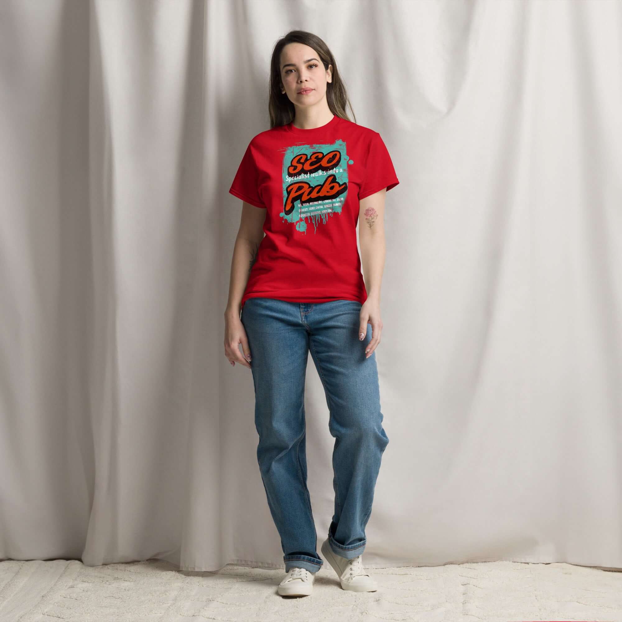Red "SEO Specialist Walks Into a Pub" t-shirt, perfect for digital marketers with a sense of humor. Features bold, colorful text.