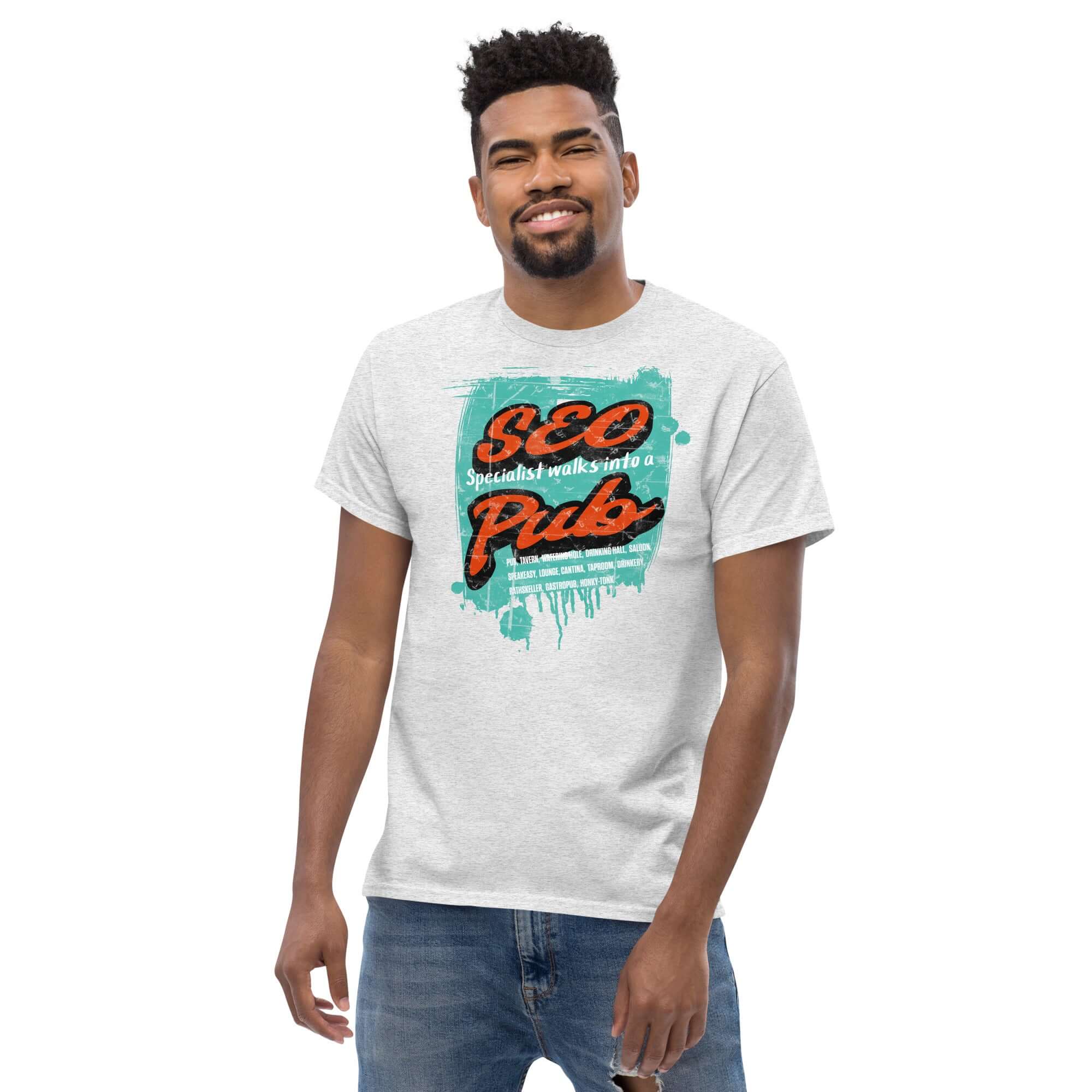 Man wearing 'SEO Specialist Walks Into a Pub' T-shirt, digital marketing humor tee, perfect for SEO enthusiasts.