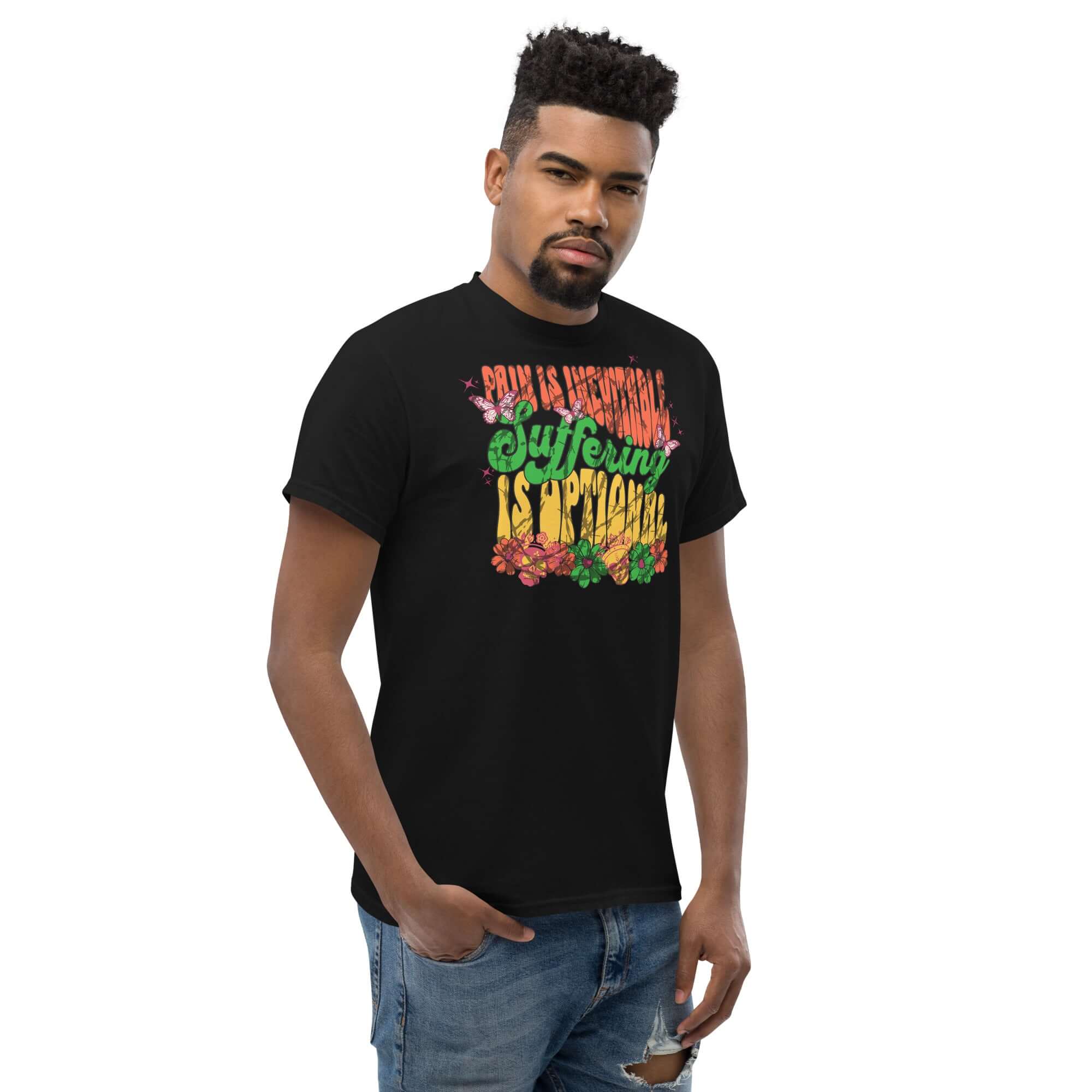 Man wearing Stoic Philosophy Drip T-Shirt with 'Pain Is Inevitable, Suffering Is Optional' psychedelic design in colorful text.