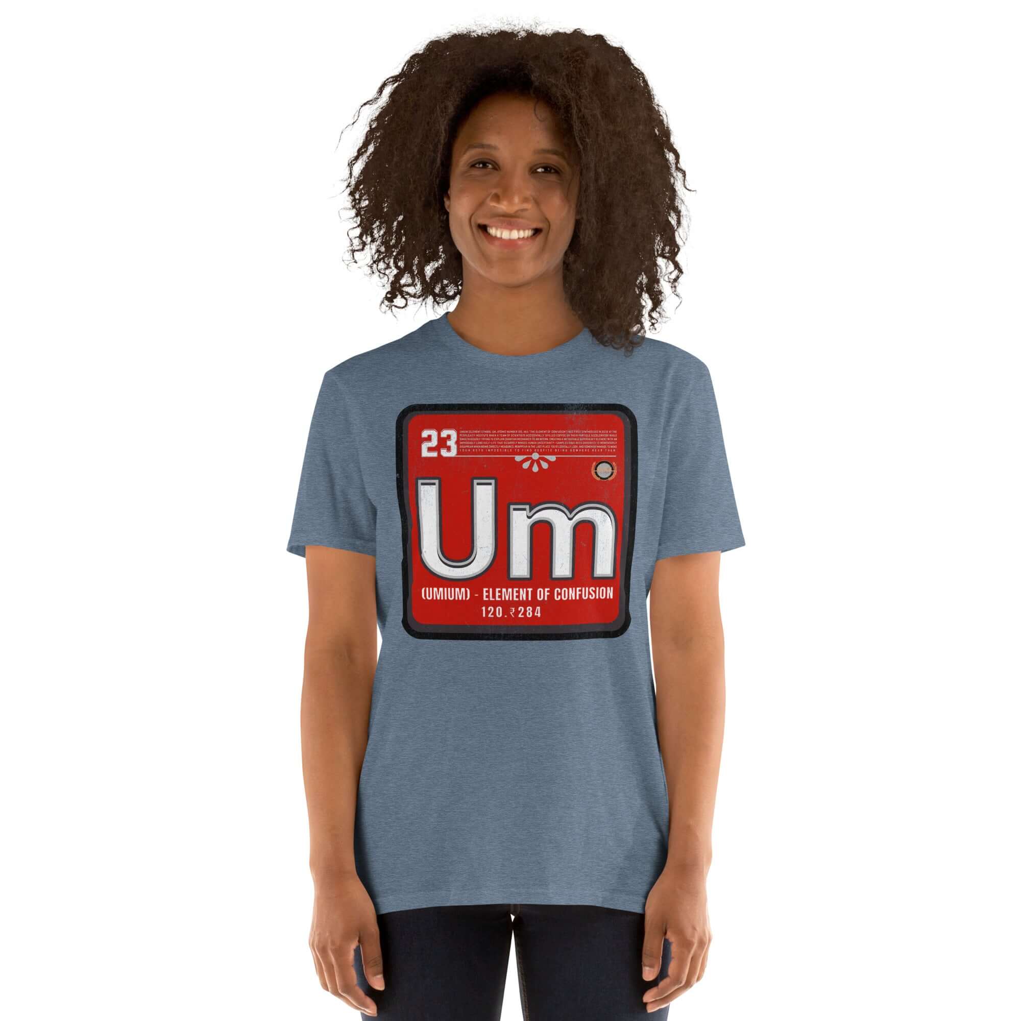 Person wearing blue "Umium Element of Confusion" t-shirt with periodic table design and red background, humor science theme.