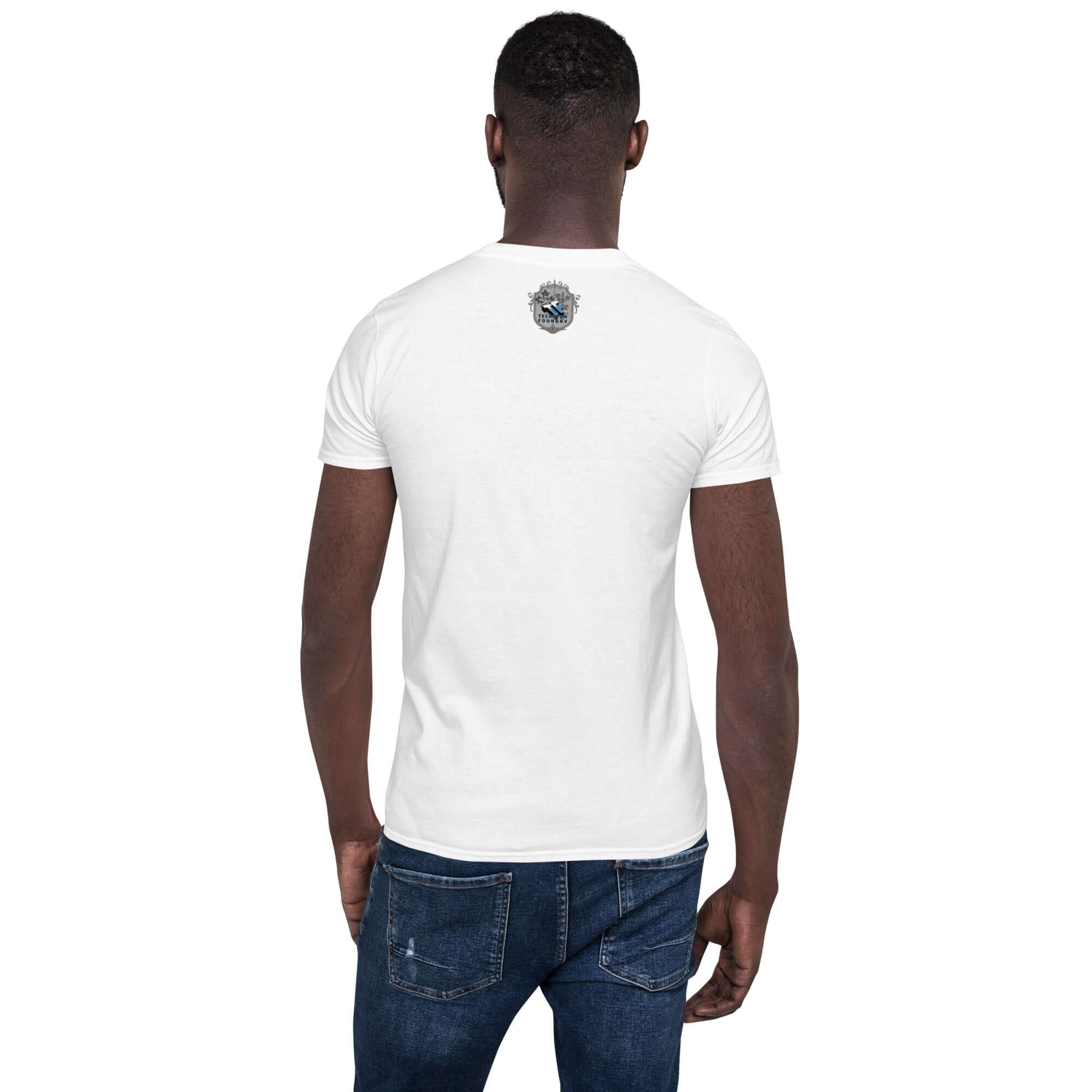Back view of a man wearing a white Umium Element T-Shirt featuring a small periodic table design, paired with blue jeans.